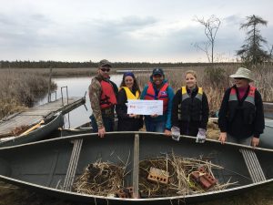 KLT volunteers loading up the platforms in canoes to take out onto the Creek