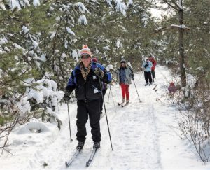 Visitors cross-country skiing at Ballyduff Trails