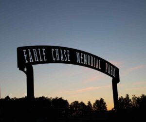 Earle Chase Memorial Park sign seen at dusk