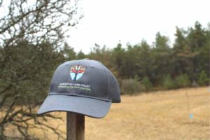 Kawartha Land Trust baseball cap on a post at Ballyduff Trails in Kawartha Lakes in fall