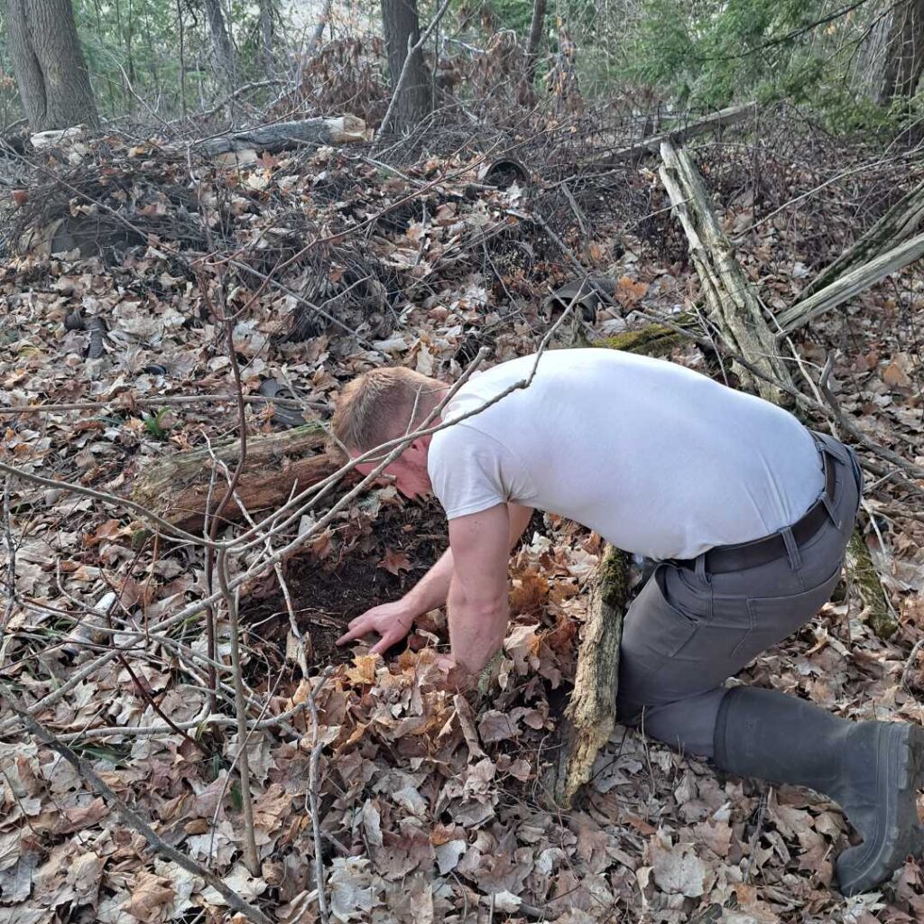 KLT volunteer looking for a salamander