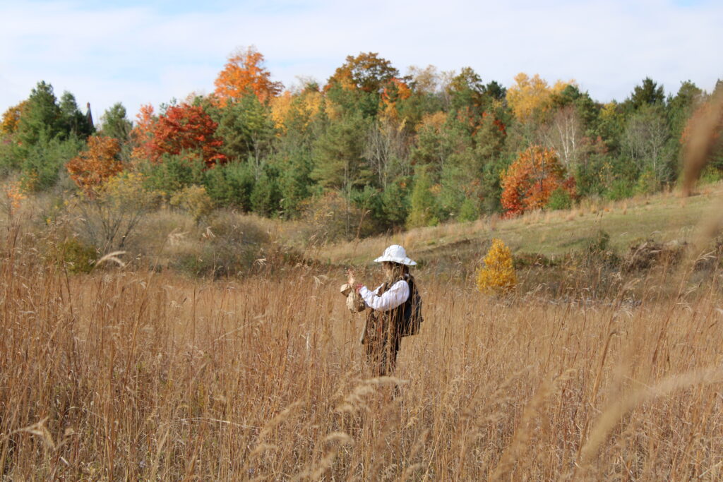Person taking a fall photo at Kawartha Land Trust's Ballyduff Trails