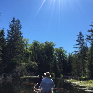 Two people canoeing at Kawartha Land Trust's DeNure Conservation Easement Agreement at Balsam Lake in Kawartha Lakes