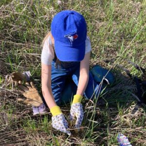 Young volunteer planting a tree