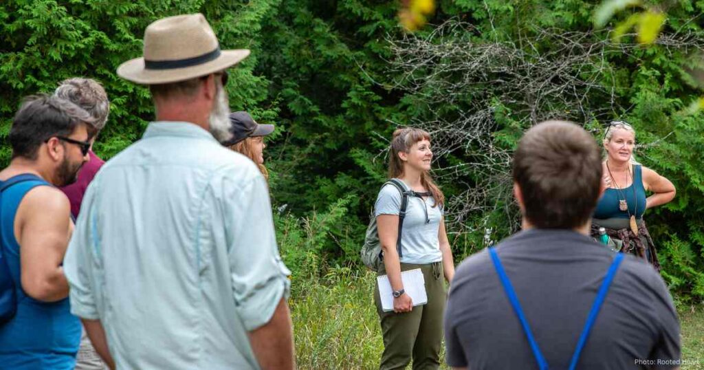Katrina Domsic leading a hike in nature