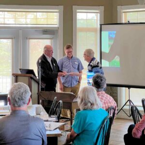 Al Sippel receiving legacy volunteer recognition from KLT Chair Paul Downs at KLT's 2023 Annual General Meeting in Burleigh Falls