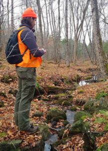 Canadian Conservation Corps Intern conducting a site visit at Kawartha Land Trust's Elliott Property