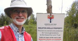 Richard Raper standing at Ingleton-Wells property trailhead in North Kawartha.