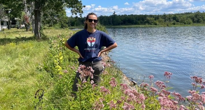 Michaela Dupuis along the shoreline at Hammer Family Nature Preserve