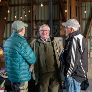 Three volunteers chatting at KLT's 2025 Thanks.Giving event.