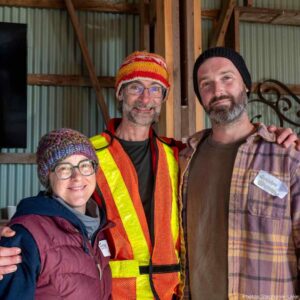 Two volunteers with Christ Gooderham, Partners in Conservation Coordinator, at KLT's 2025 Thanks.Giving event.