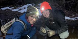 Two KLT volunteers out on a PIC member property doing a salamander survey.
