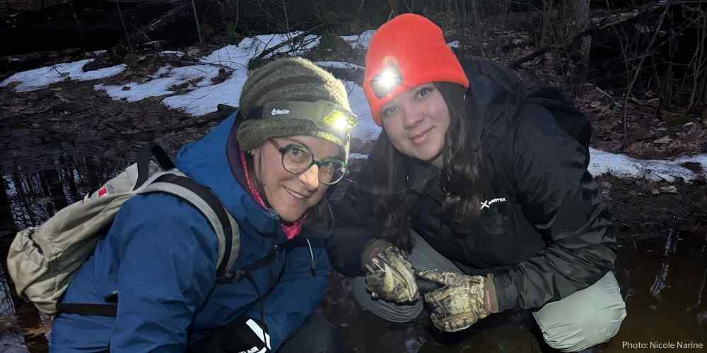 Two KLT volunteers out on a PIC member property doing a salamander survey.