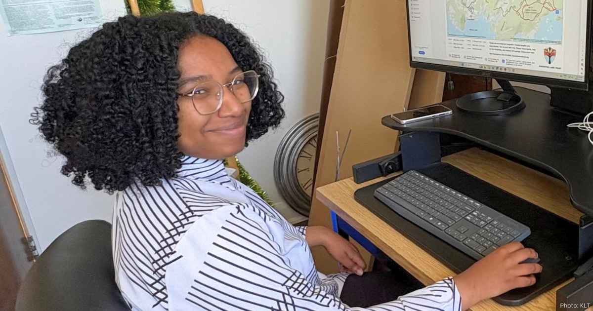 Geanna Collins at her desk in the KLT office.